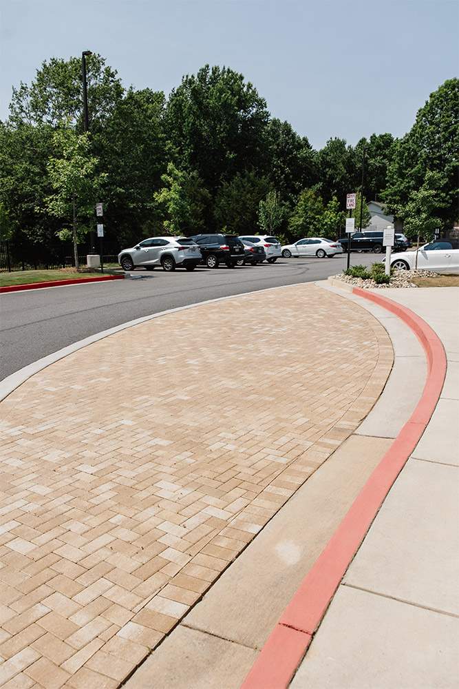 Paved parking area with cars and landscaped curb in Metro Atlanta